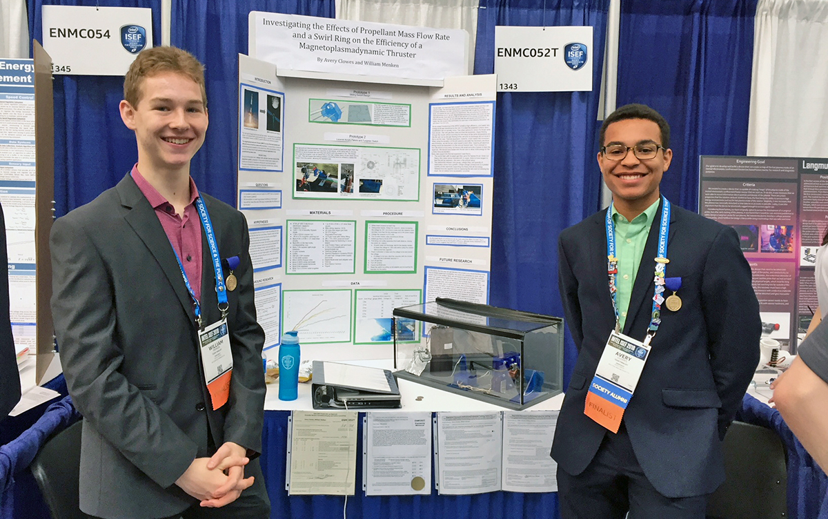 Menken and Clowes present their magnetoplasmadynamic thruster project at the Intel International Science and Engineering Fair in 2018.