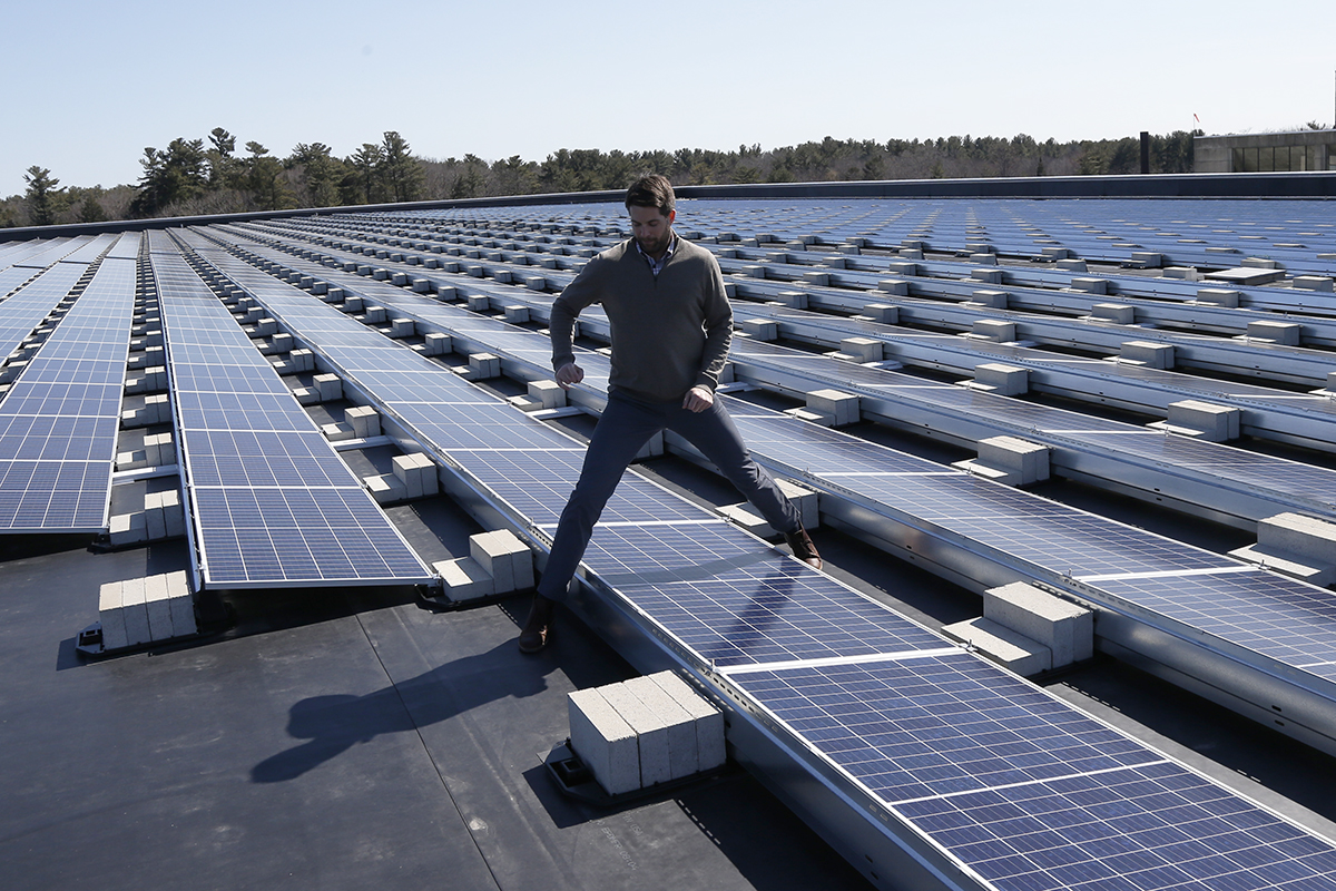 Warren Biggins steps over a solar panel at Exeter