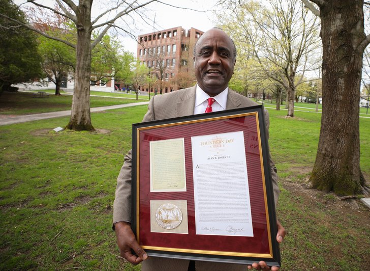 Alan Jones holds his framed Founders' Day Award