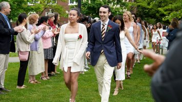 Class Marshal Bryce Morales leads classmates to chairs at the Phillips Exeter Academy graduation.