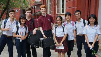 Exeter musicians with a group of students in Vietnam