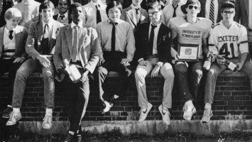 Photo of Eddie Perry and his dorm mates sitting on a wall at Exeter.