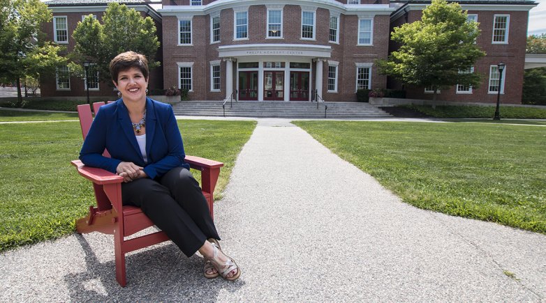 Joanne Lembo sitting outside in front of the Academy Center.