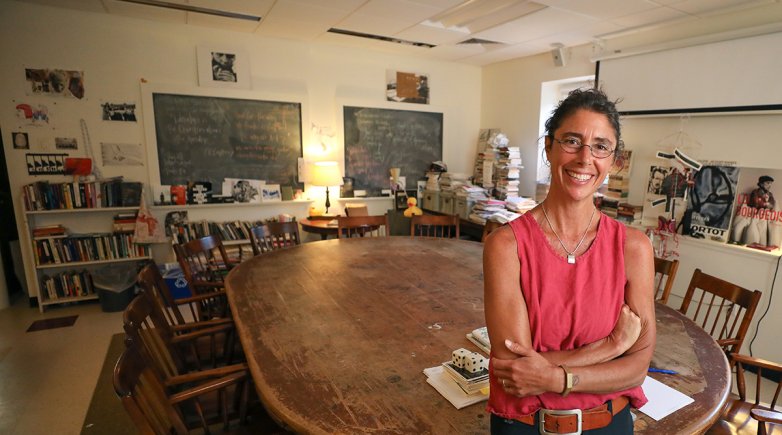 Instructor Mercy Carbonell stands in her classroom