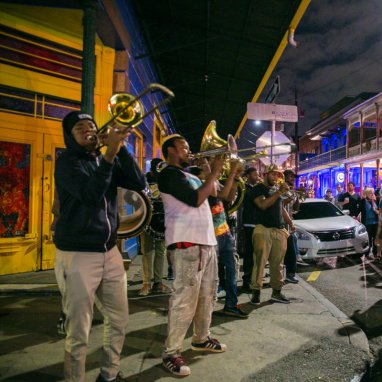 Musicians playing at night on a street in New Orleans
