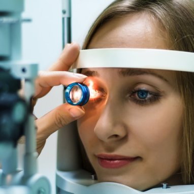 A woman receiving an eye exam.