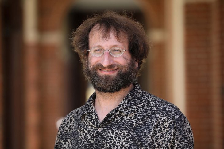 Smiling man with glasses and beard